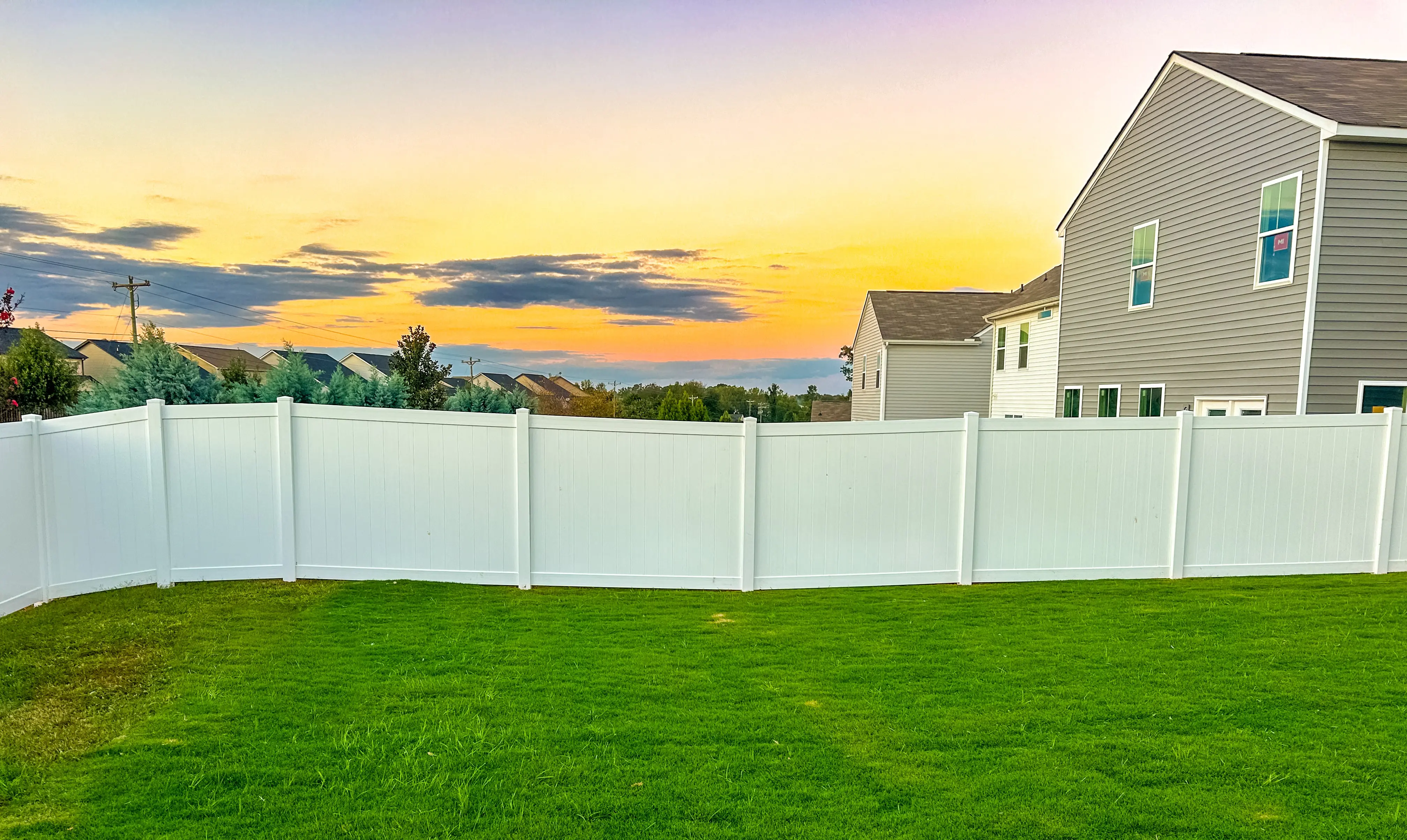 Newly installed wooden privacy fence